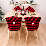 New home decor items for Christmas season, featuring red and black checkered patterns with white fur balls. Chair covers for Christmas atmosphere decoration