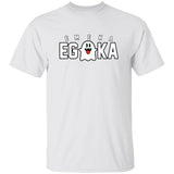 White t-shirt with 'EMEKA EGOKA' text and a logo on a white background