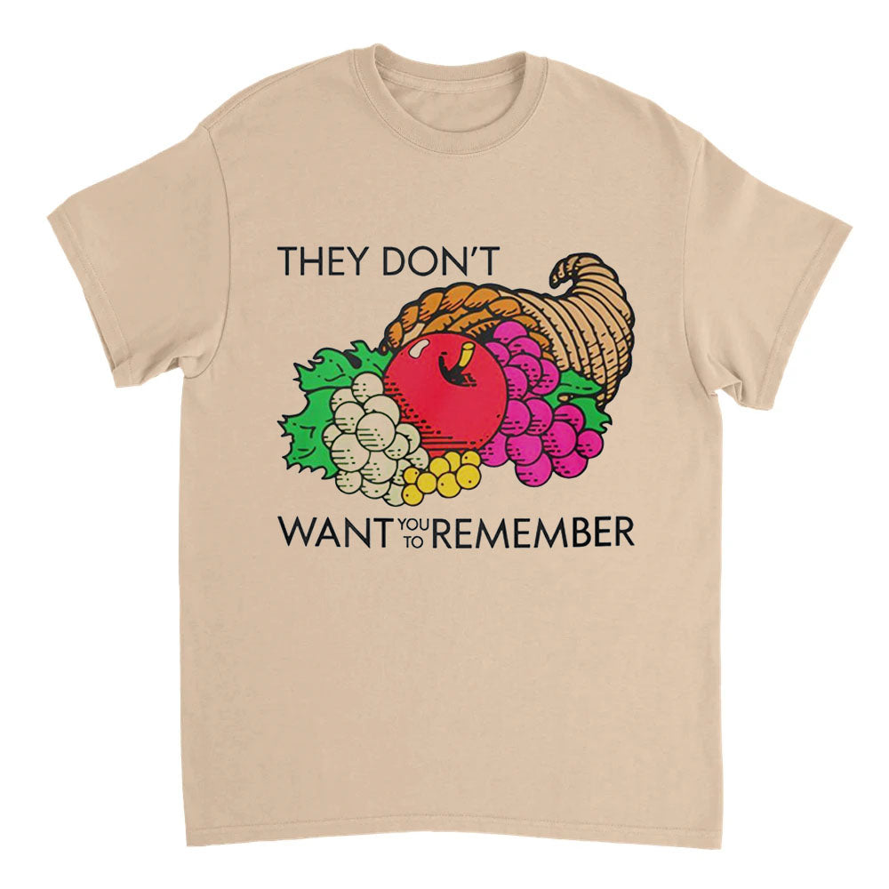 Beige t-shirt with a graphic of fruits and vegetables and text on a white background