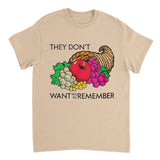 Beige t-shirt with a graphic of fruits and vegetables and text on a white background