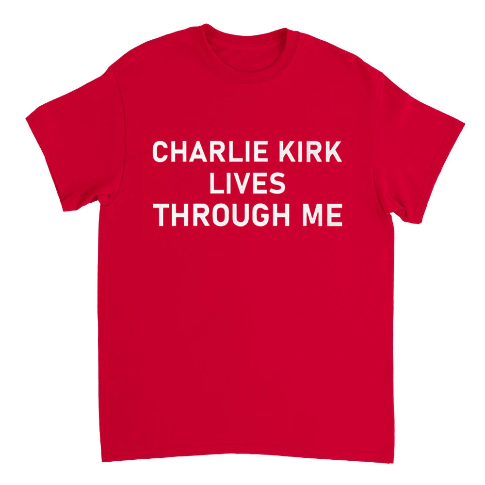 Red t-shirt with white text 'CHARLIE KIRK LIVES THROUGH ME' on a white background