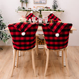 New home decor items for Christmas season, featuring red and black checkered patterns with white fur balls. Chair covers for Christmas atmosphere decoration