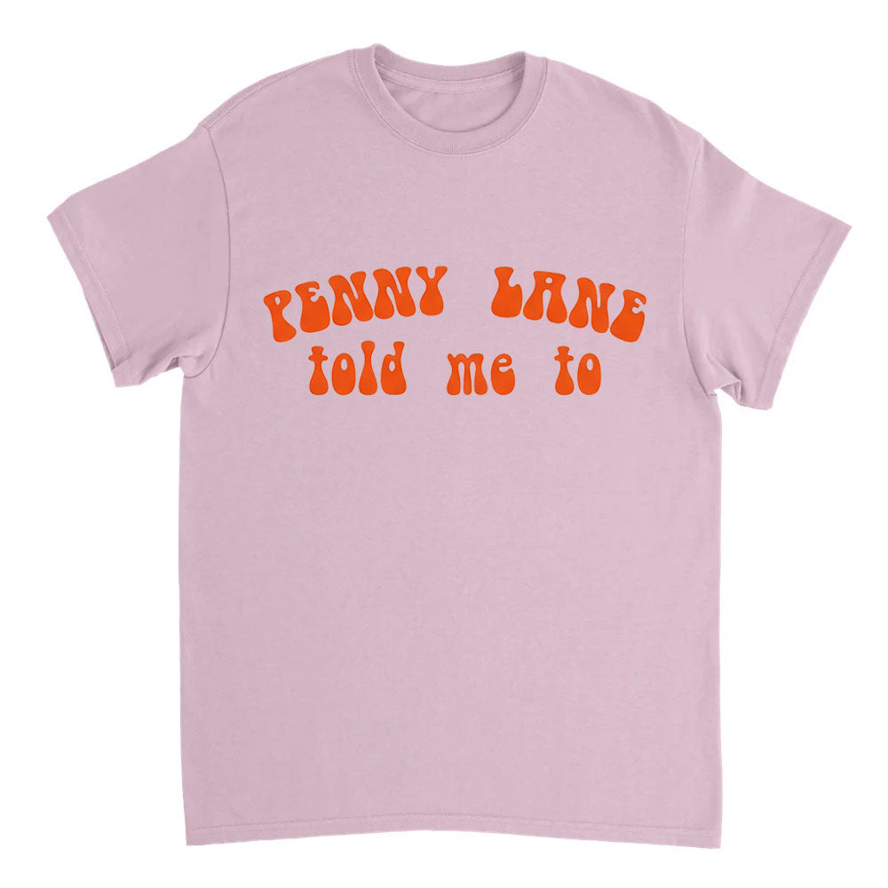 Pink t-shirt with orange text 'Penny Lane told me to' on a white background