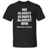 Black t-shirt with white text 'WE ALMOST ALWAYS ALMOST WIN NEBRASKA FOOTBALL' on a white background