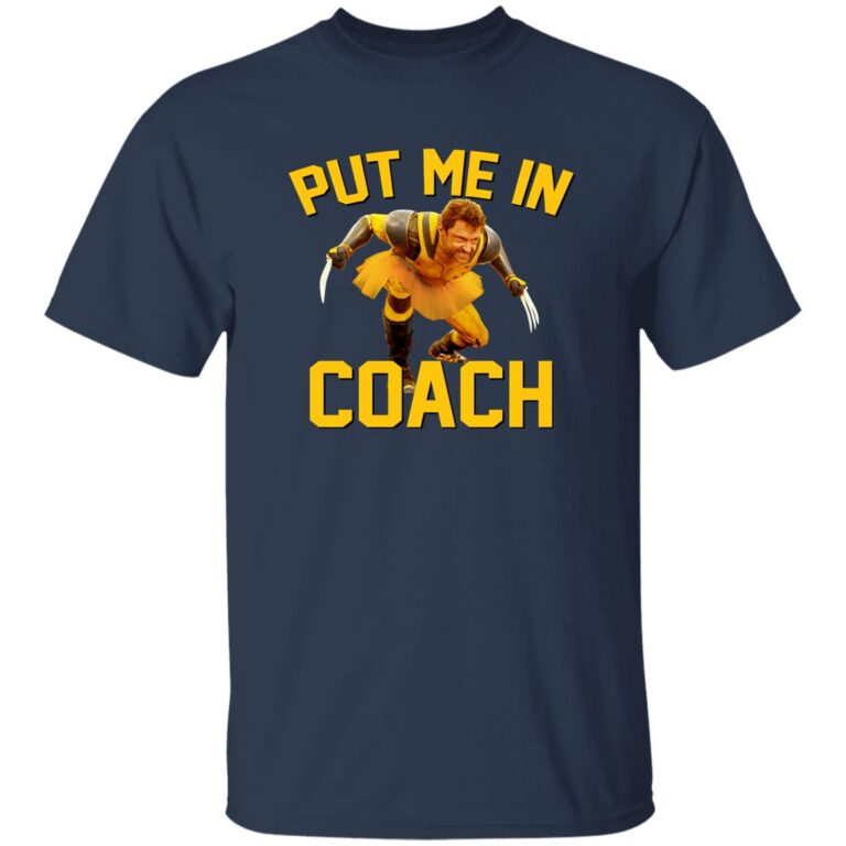 Navy blue t-shirt with a graphic of a character in a yellow outfit and text 'PUT ME IN COACH' on a white background.