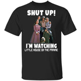 Black t-shirt with 'Shut Up! I'm Watching Little House on the Prairie' text and character graphic.