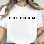 Person wearing a white t-shirt with 'FREEDOM' printed on it.
